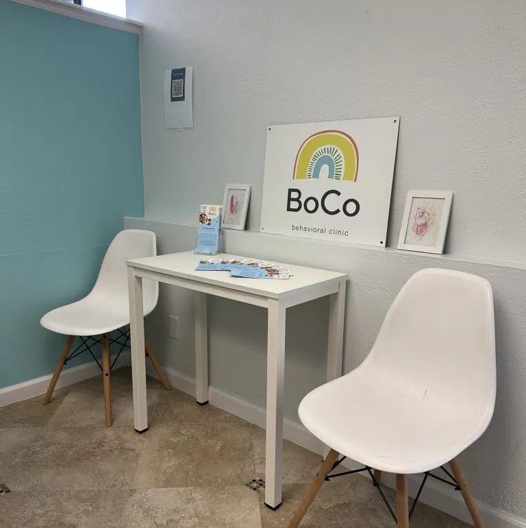 Louisville clinic room with a small table and white chairs